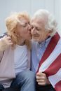 Woman Kissing an Elderly Man
