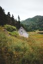 Brown Wooden House on Green Grass Field
