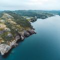 Coastline Explorer app icon: aerial view of rugged coastal cliffs — photo by Erik Mclean on Pexels