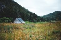 A Barn on Green Grass Field