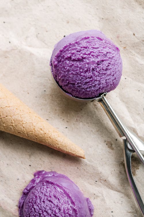 Purple Ice Cream and Cone on Gray Surface