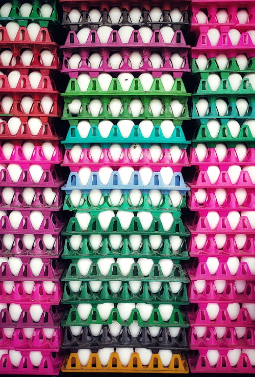 Eggs on Colored Trays Stacked Up