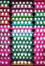 Eggs on Colored Trays Stacked Up