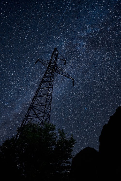 Free Silhouette of Trees and Electric Tower Under Starry Night Stock Photo