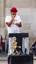 Man in White Shirt Playing Flute