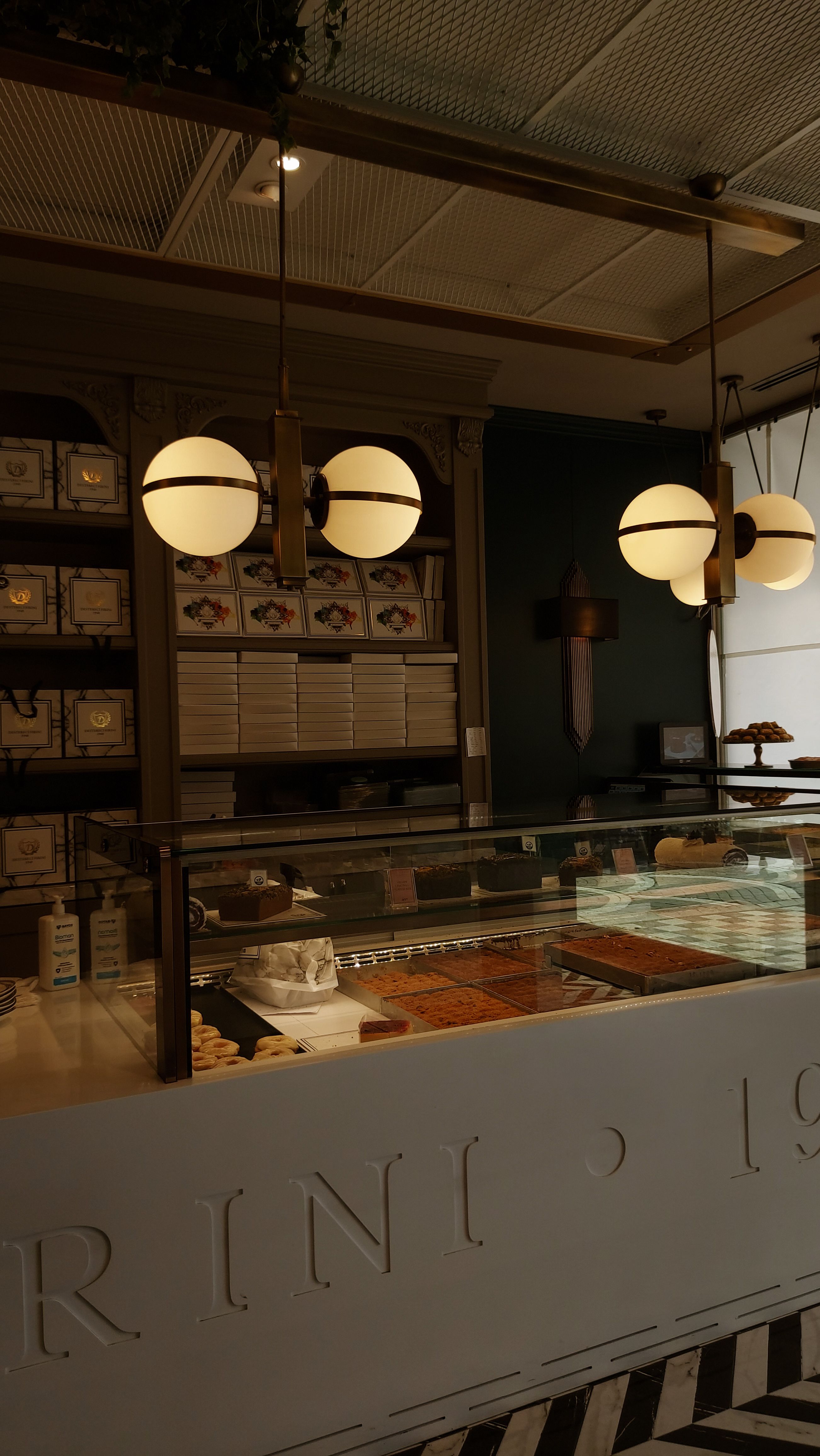 Cozy rustic bakery interior showcasing fresh pastries in a warm setting.