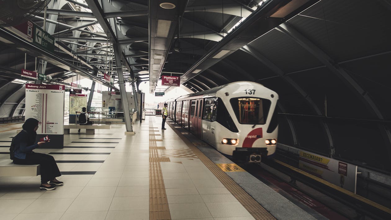 Indoor Train Station With Few People Waiting for the Train