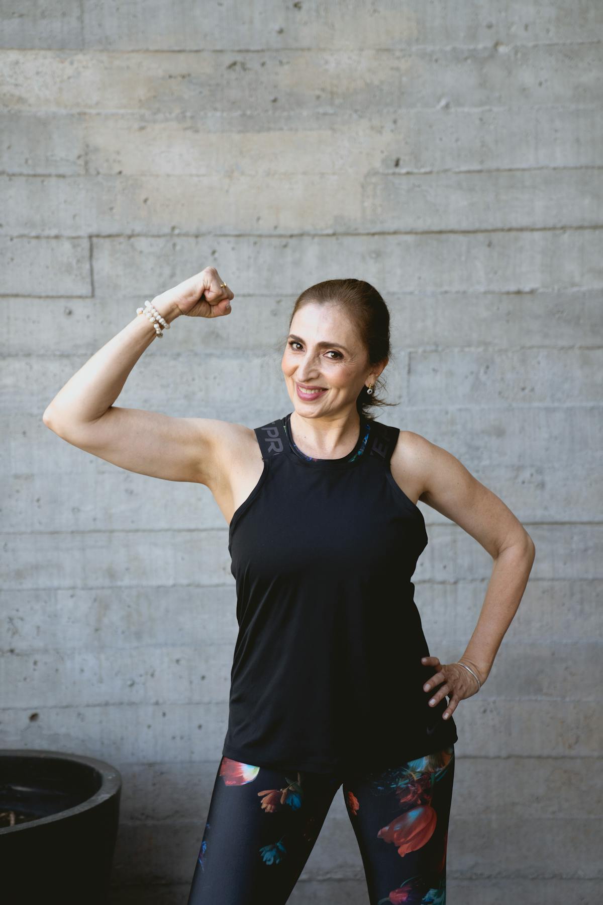 Fit woman over 40 in sportswear ready for strength training