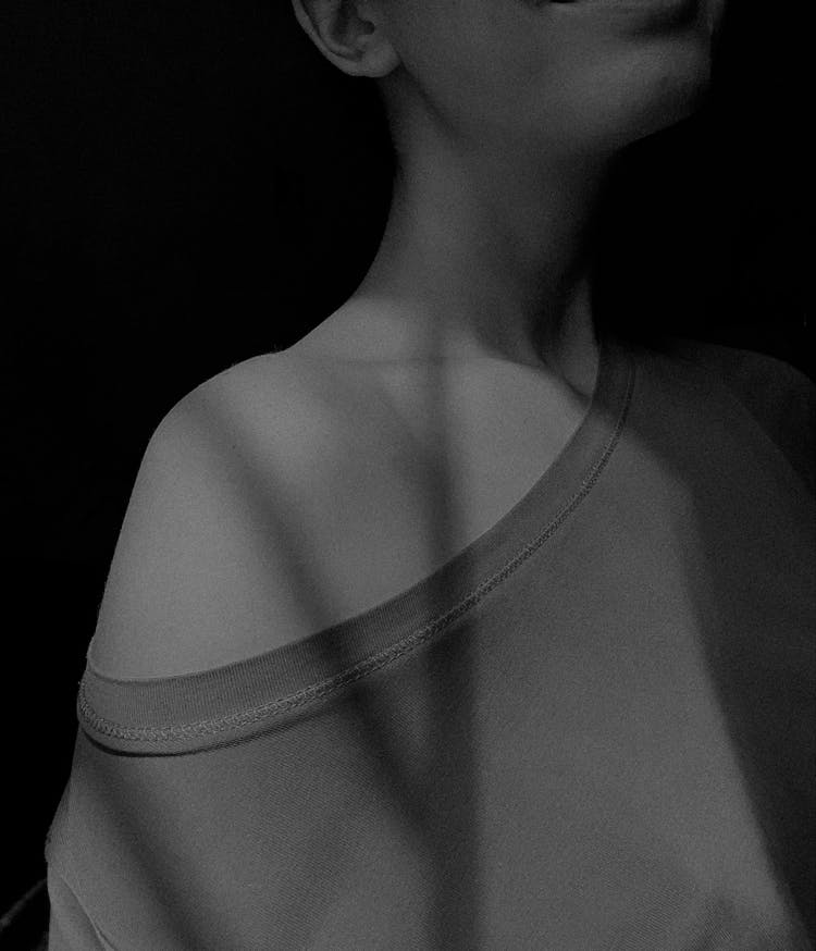 Monochrome Shot Of The Shoulder Of A Woman 