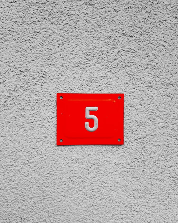 Photo Of The Number Five On A Red Plate