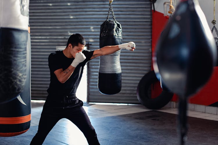 Man Shadow Boxing On A Boxing Gym 