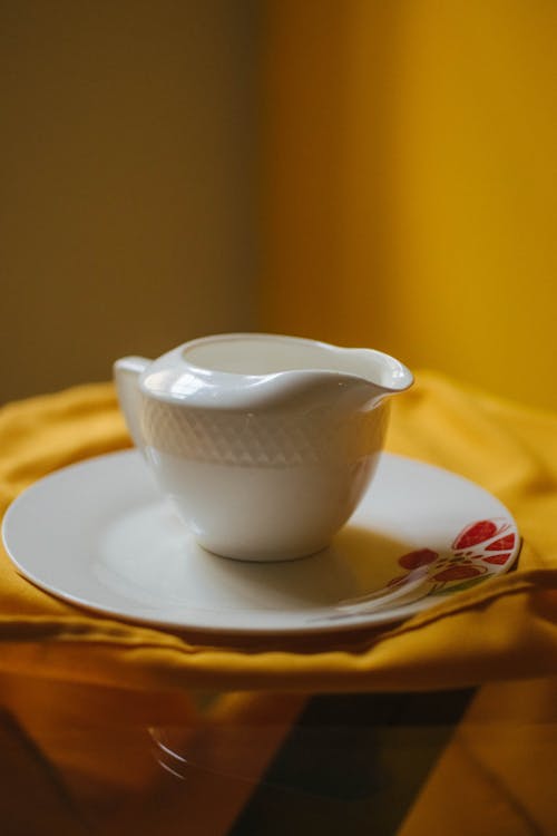 Free Close-Up Shot of a White Cup on a Saucer Stock Photo