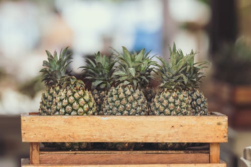 Free Pineapple Fruits on Wooden Crate Stock Photo