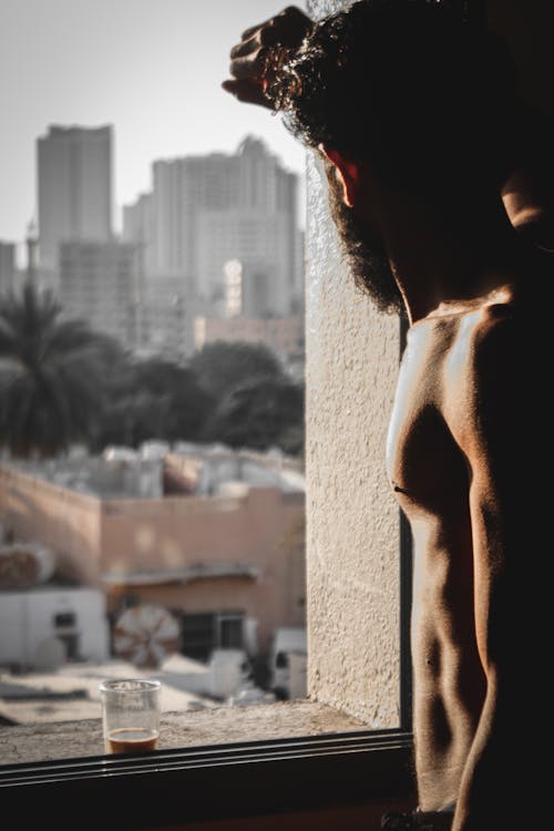Free Topless Man Leaning on a Wall  Stock Photo