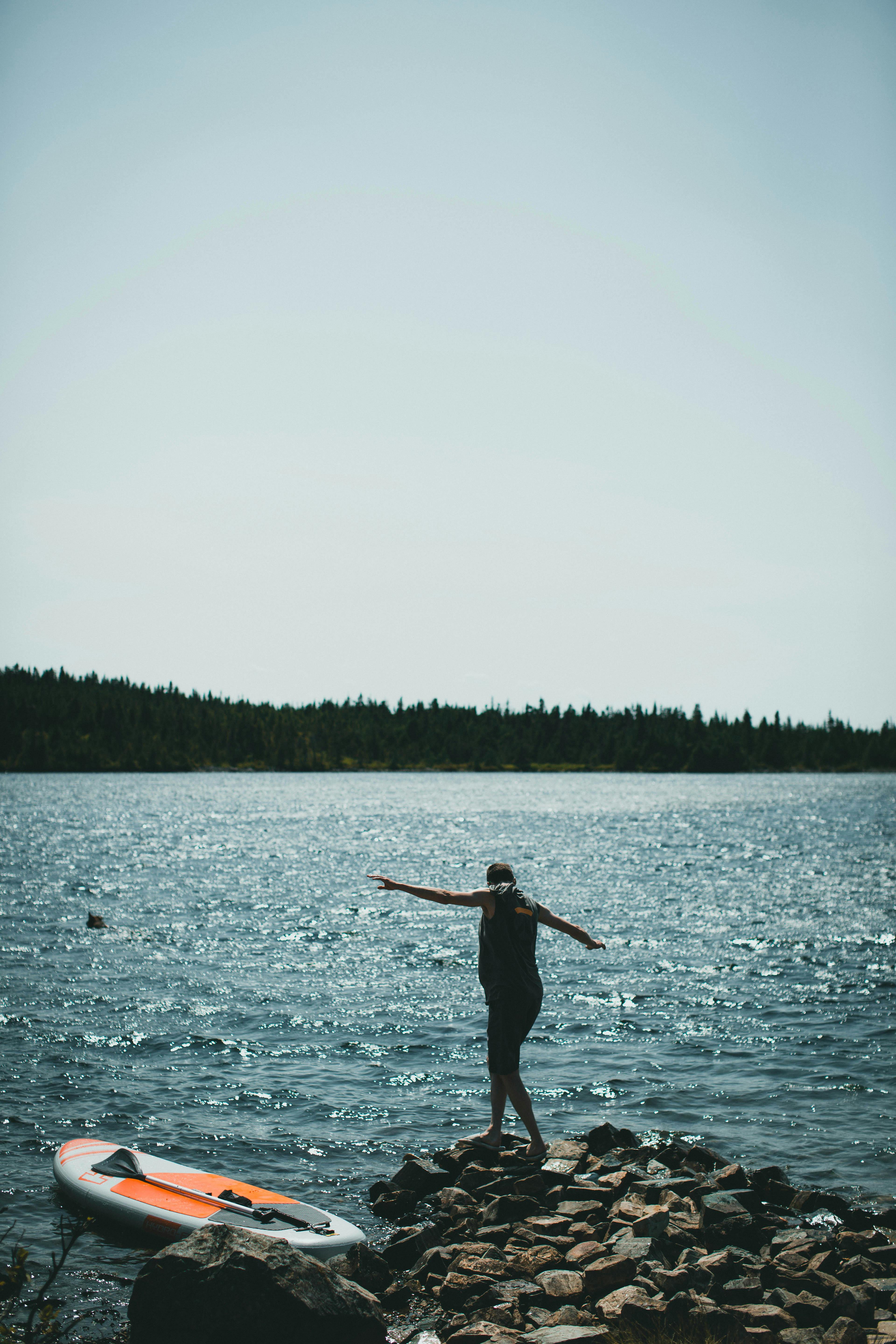 Person Standing on Rocks · Free Stock Photo