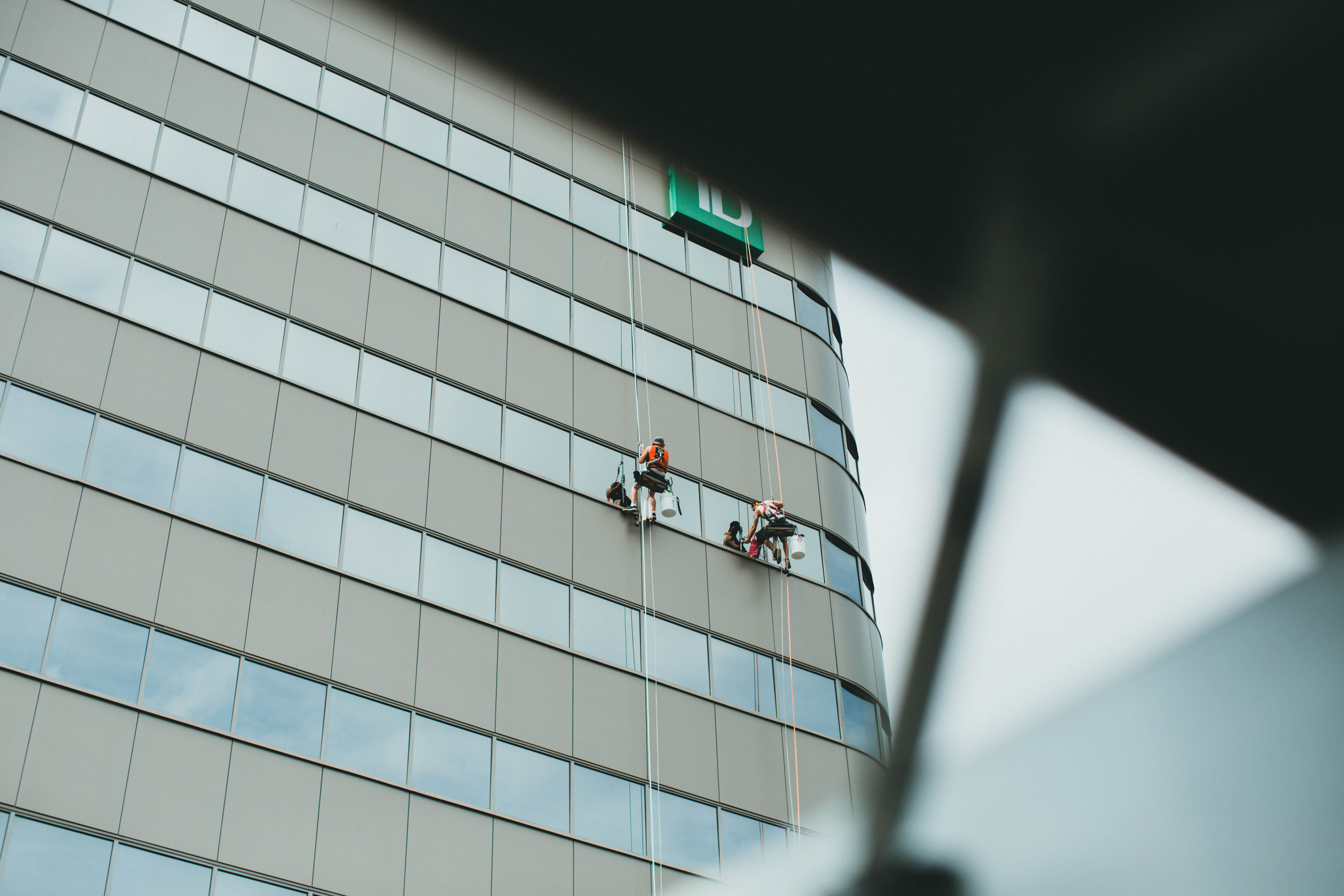 Crew cleaning the exterior of a commercial building