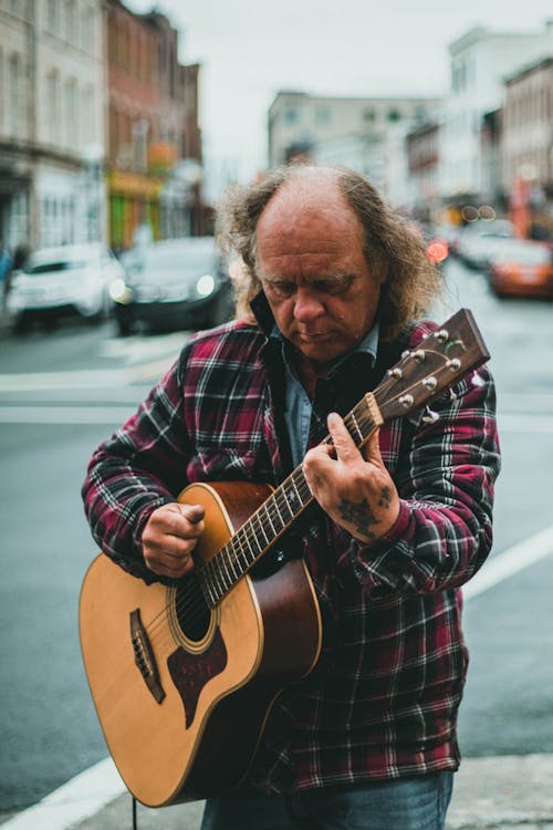 Elderly Man playing Acoustic Guitar