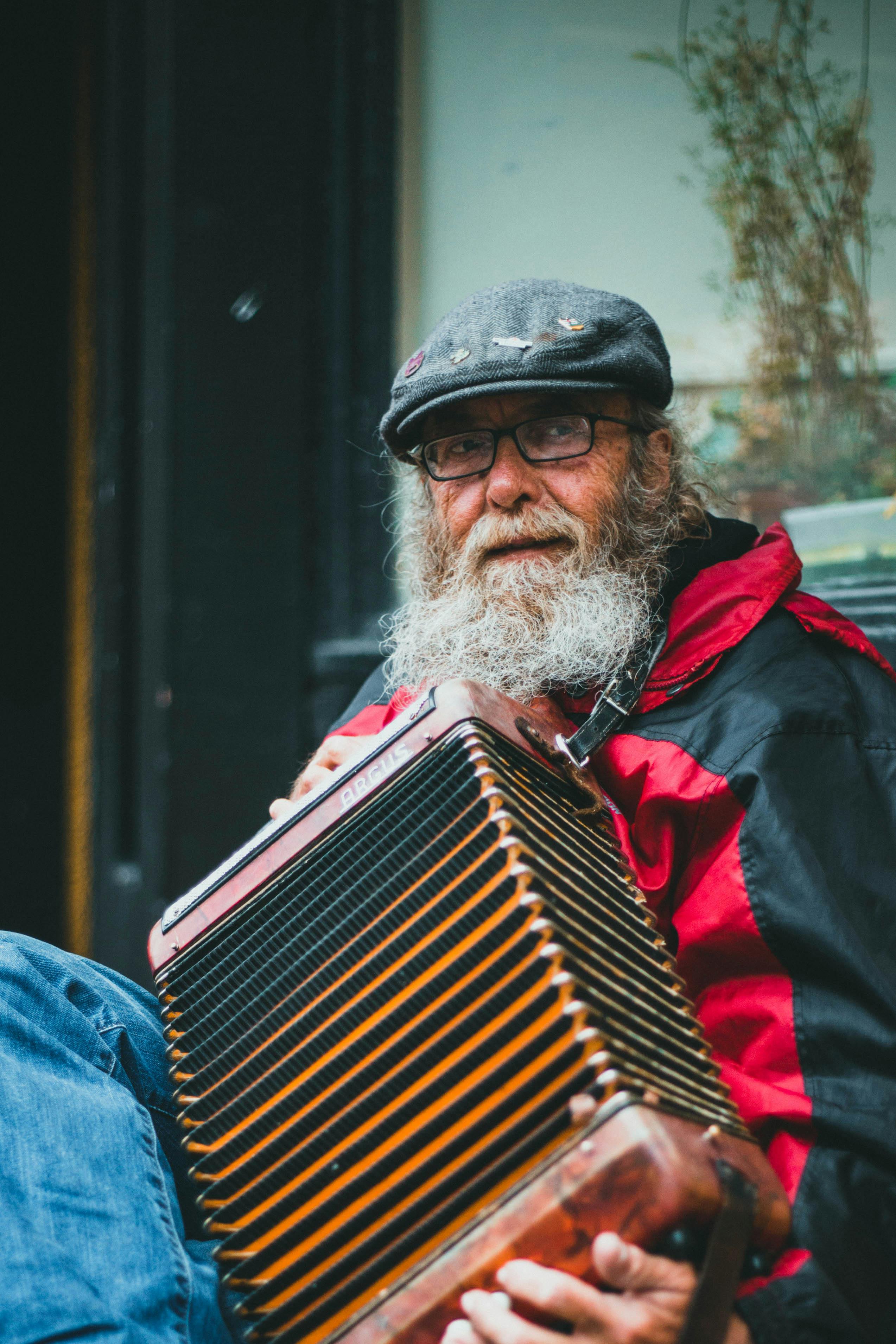 Elderly Man playing Musical Instrument · Free Stock Photo