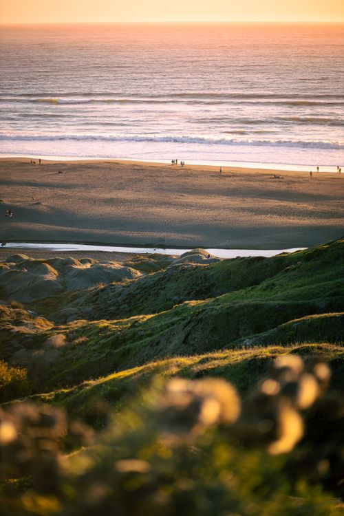 Free Scenic golden hour view of Matanzas beach in Chile with waves and a serene shoreline. Stock Photo