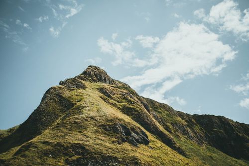 Free A striking view of a mountain peak under a clear blue sky, showcasing natural beauty. Stock Photo