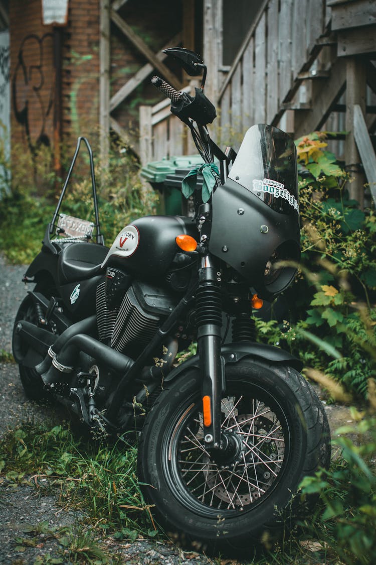 A Black Cruiser Motorcycle Parked Outside