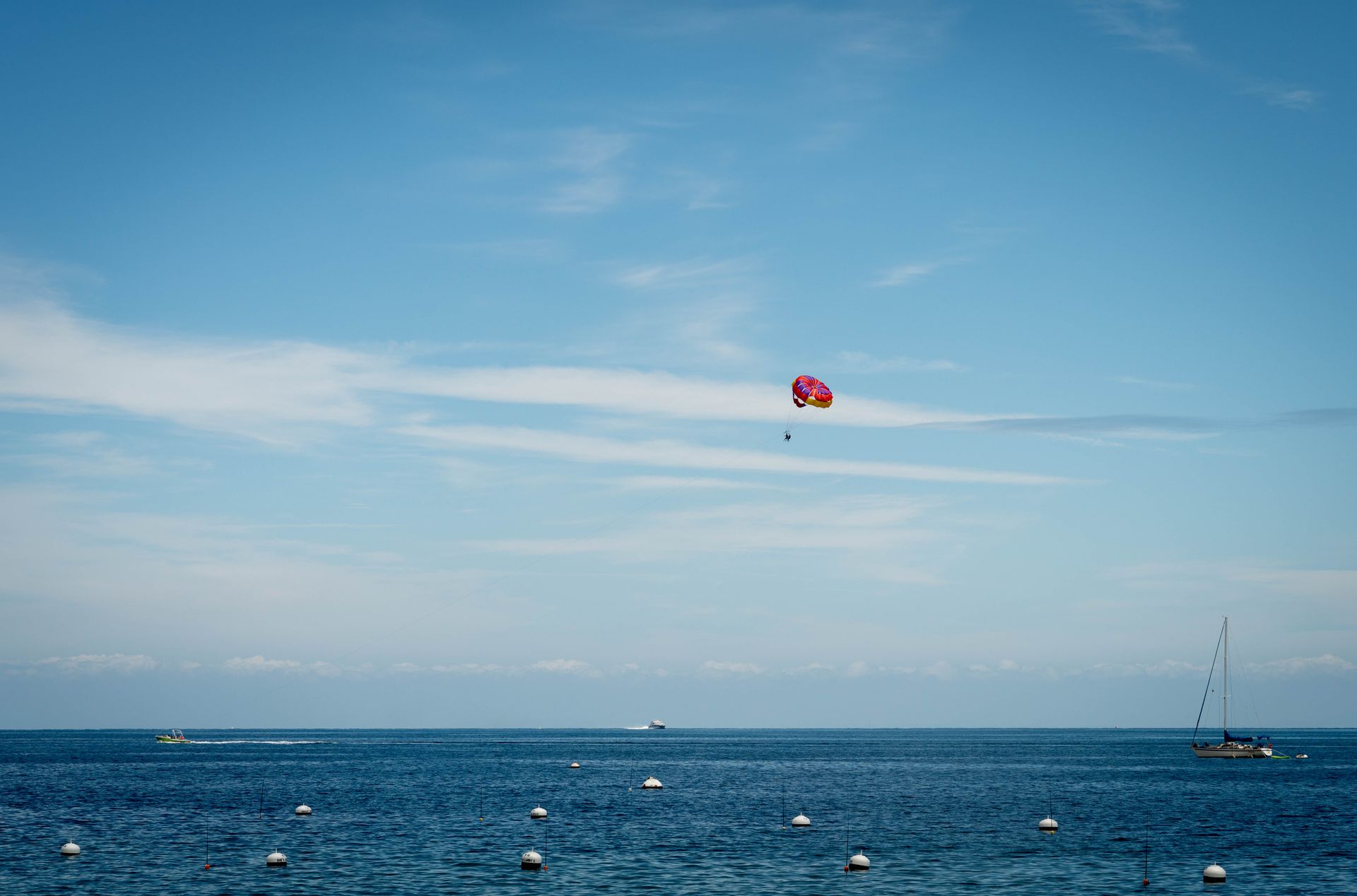 Experience the thrill of parasailing over the clear blue waters of Catalina Island, California.