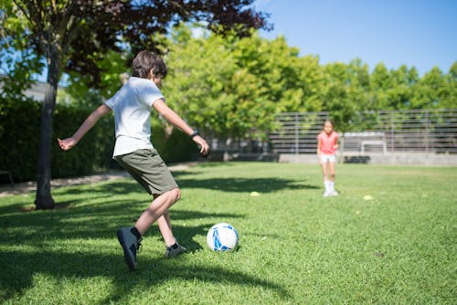 Children playing Football Together