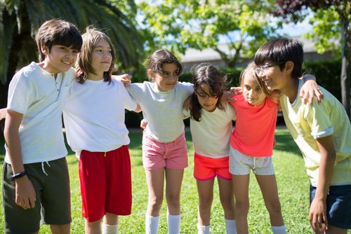 Free A joyful group of children playing outdoors, embodying friendship and happiness. Perfect lifestyle stock image. Stock Photo