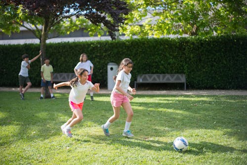 Free Children playing Football Together Stock Photo