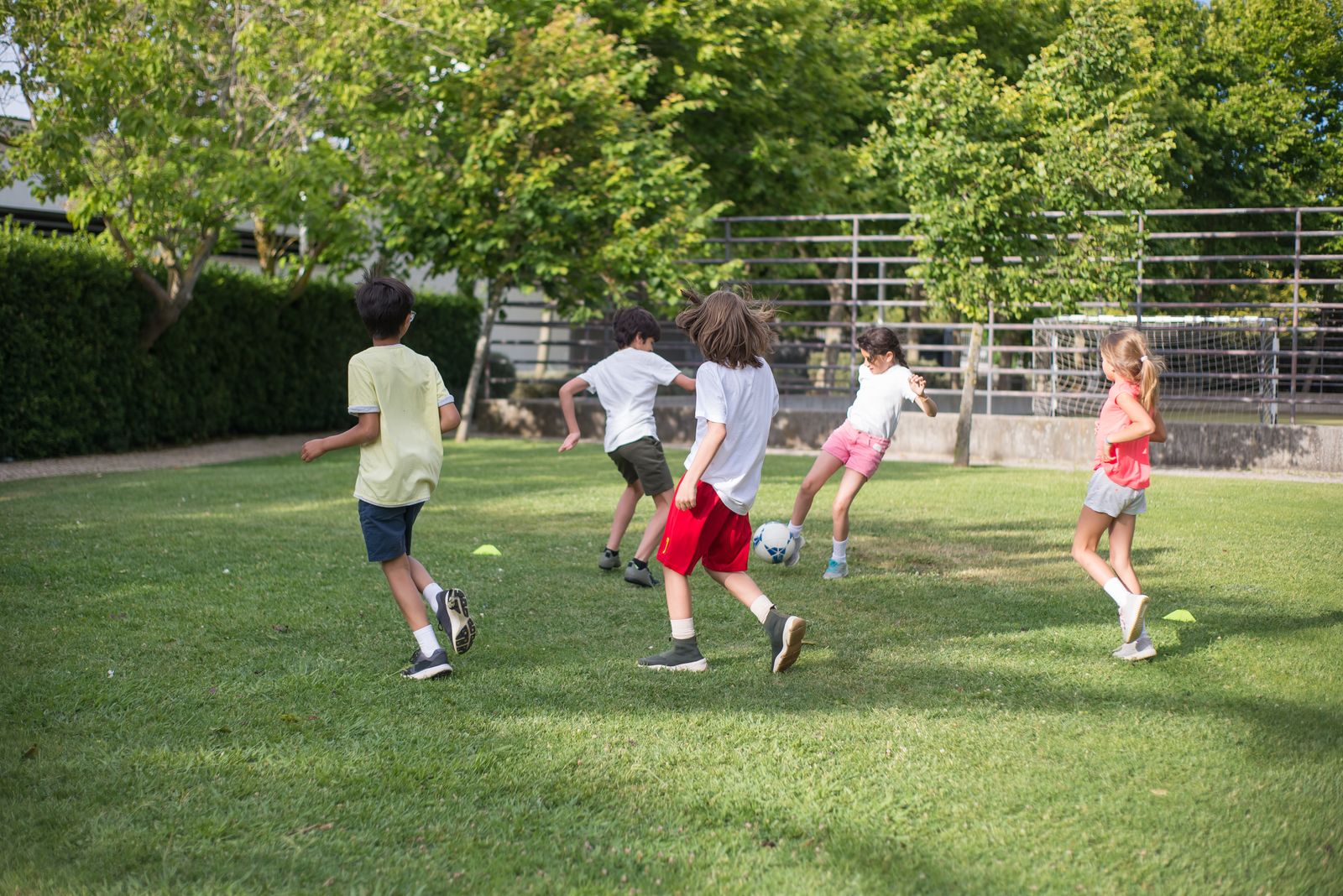 Students playing football on the school field