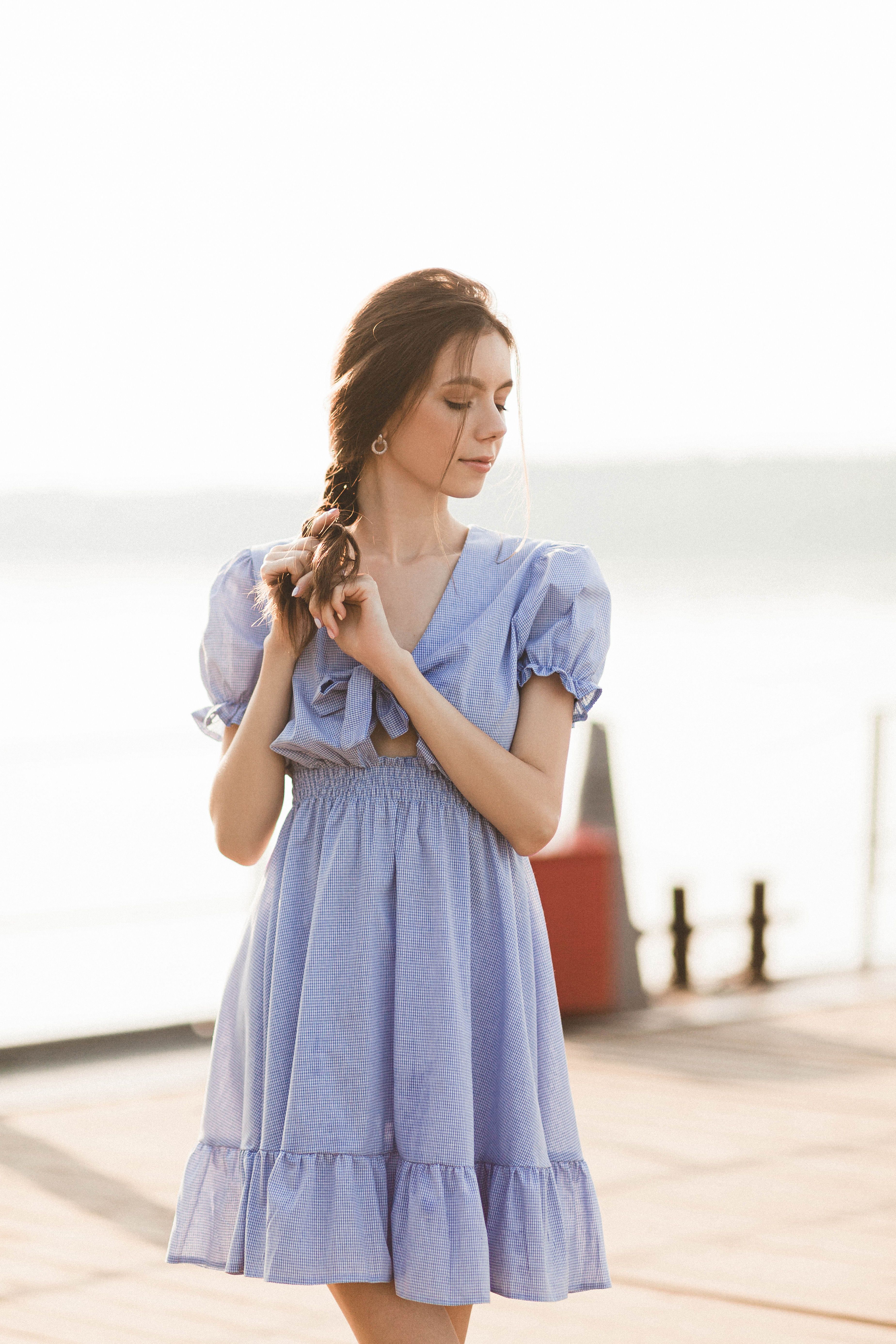 A Pretty Woman in Blue Dress Standing · Free Stock Photo