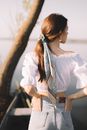 Woman in White Long Sleeve Shirt and Blue Denim Shorts