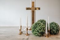 Gold Cross on White Concrete Floor