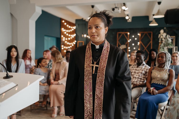 Woman Wearing A Crucifix Necklace