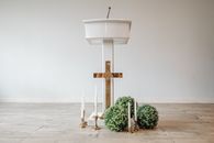 Brown Wooden Cross on White Concrete Floor