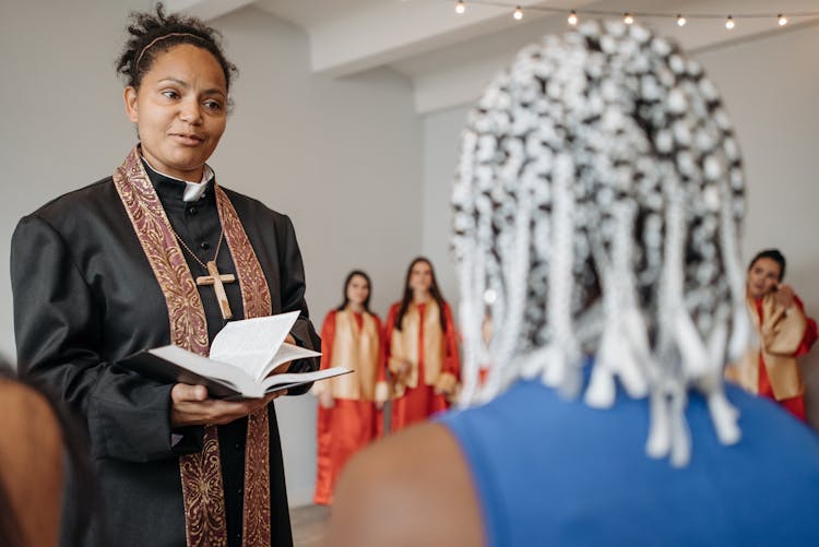 A Woman Pastor Holding Bible In The Church