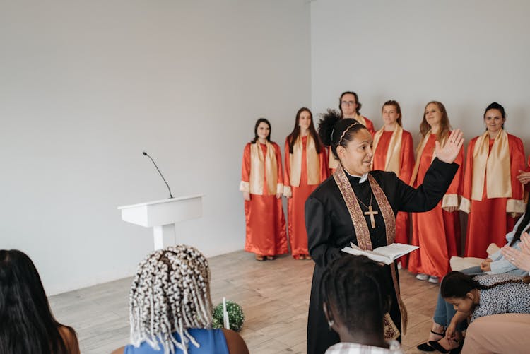 Woman Pastor Leading Ceremony In Church