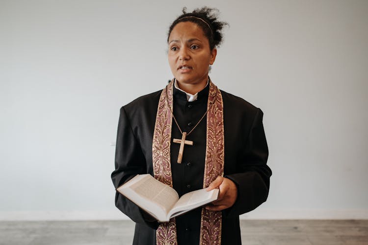 A Woman Pastor Holding Bible