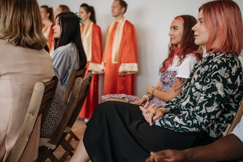 Young People Sitting in a Church