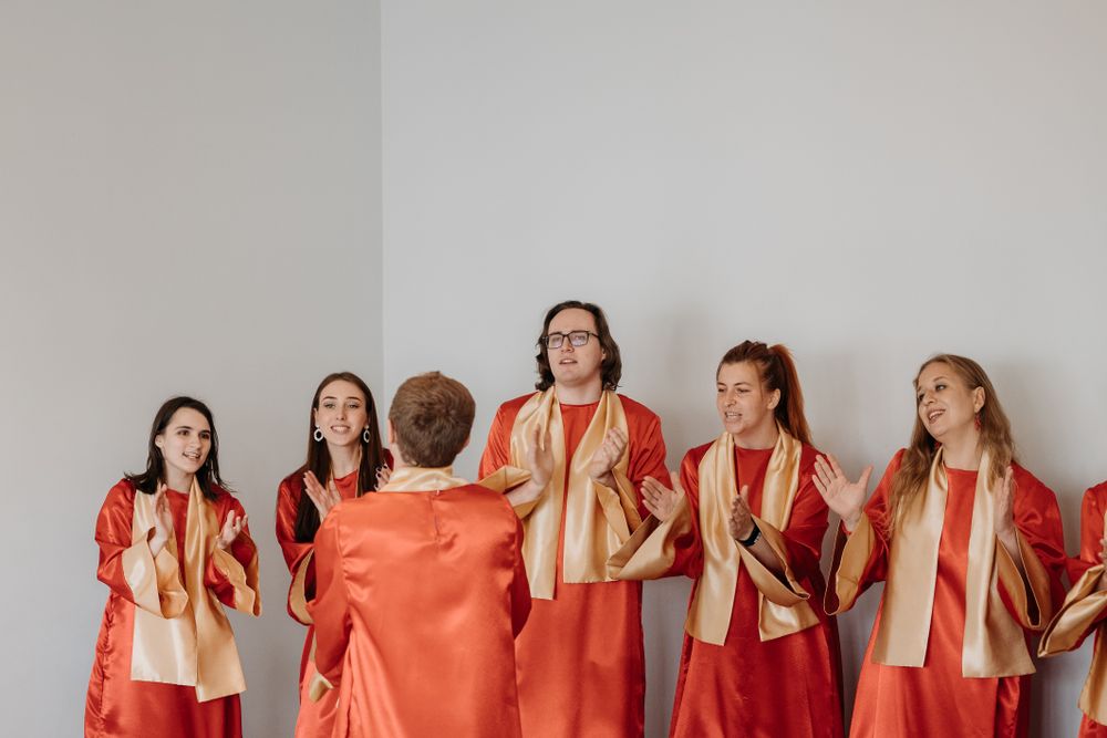 Young choir members singing together in church
