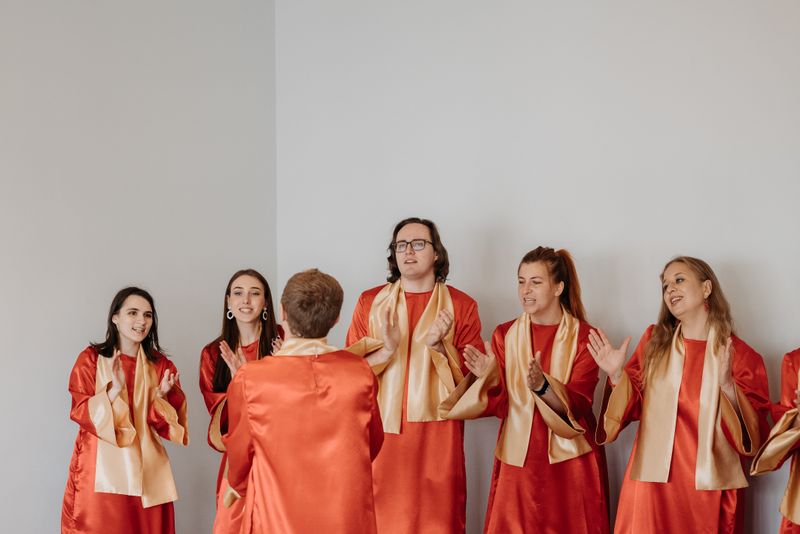 Young choir members singing together indoors