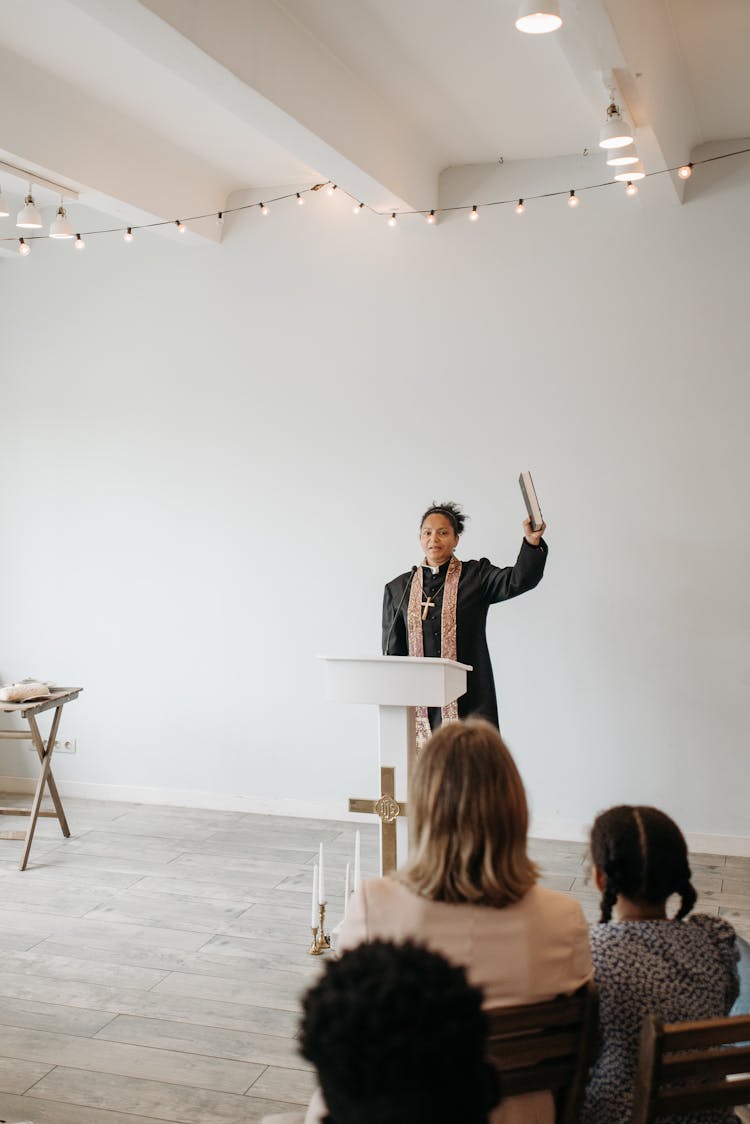 Woman Priest Giving Service