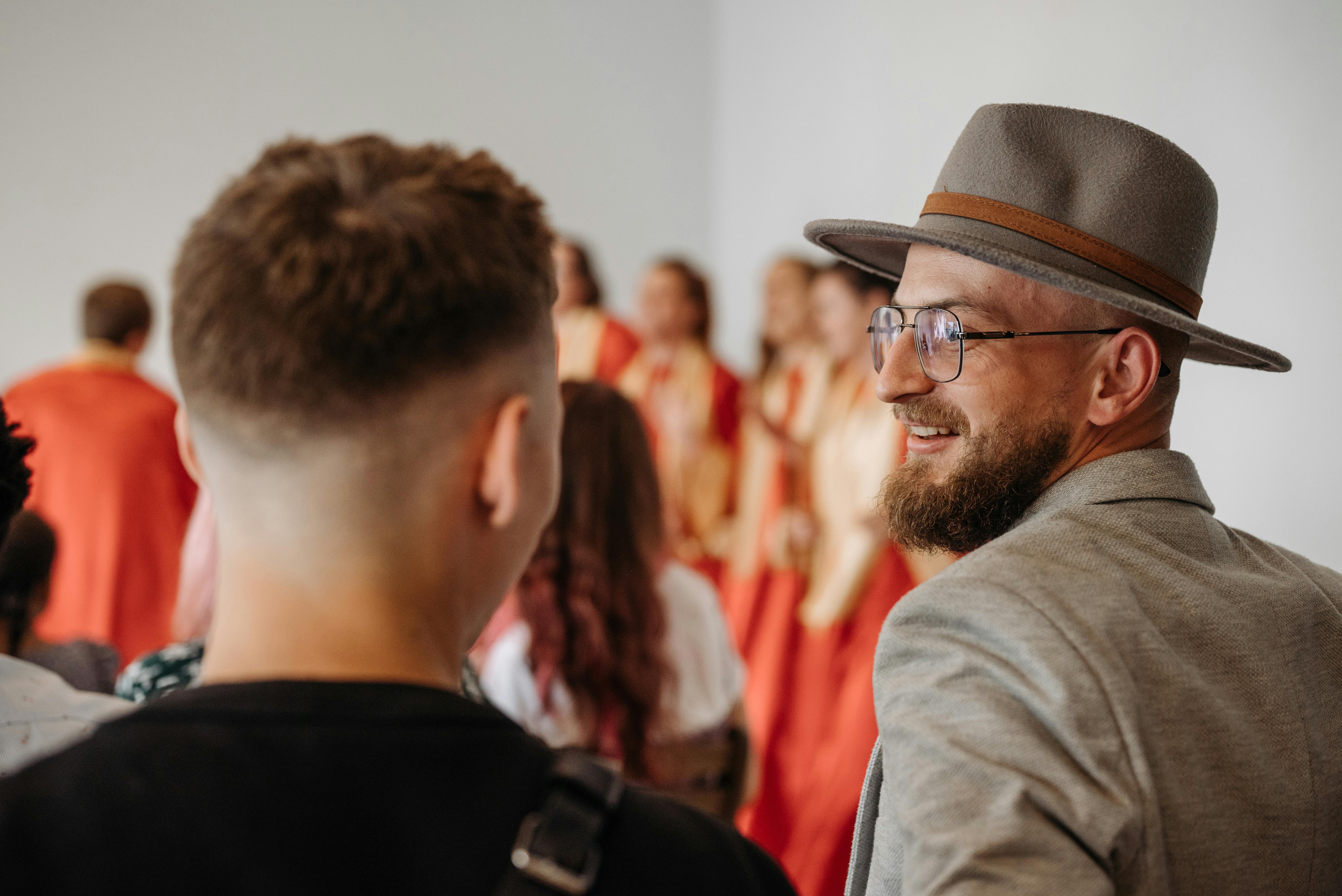 People Adjusting Their Appearance In A Social Setting