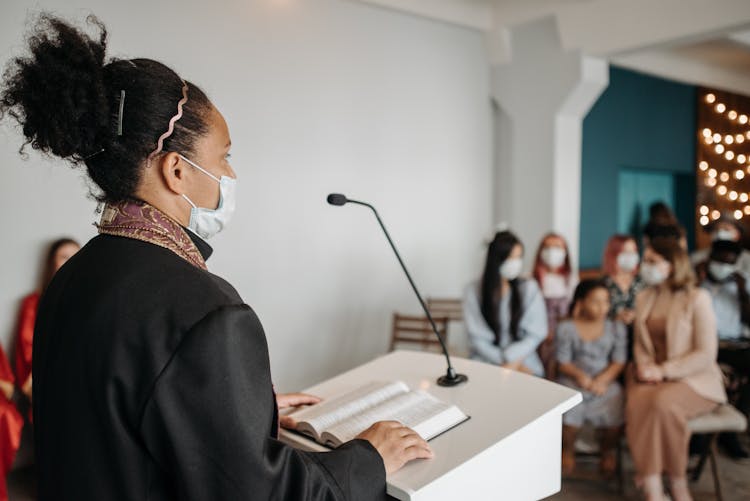 Woman Pastor Speaking In Front Of People 