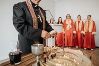 A Pastor Breaking Bread for Communion