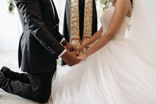Free Beautiful wedding ceremony with couple holding hands in formal attire. Stock Photo