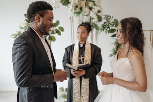 A beautiful wedding ceremony with a diverse couple exchanging vows indoors.