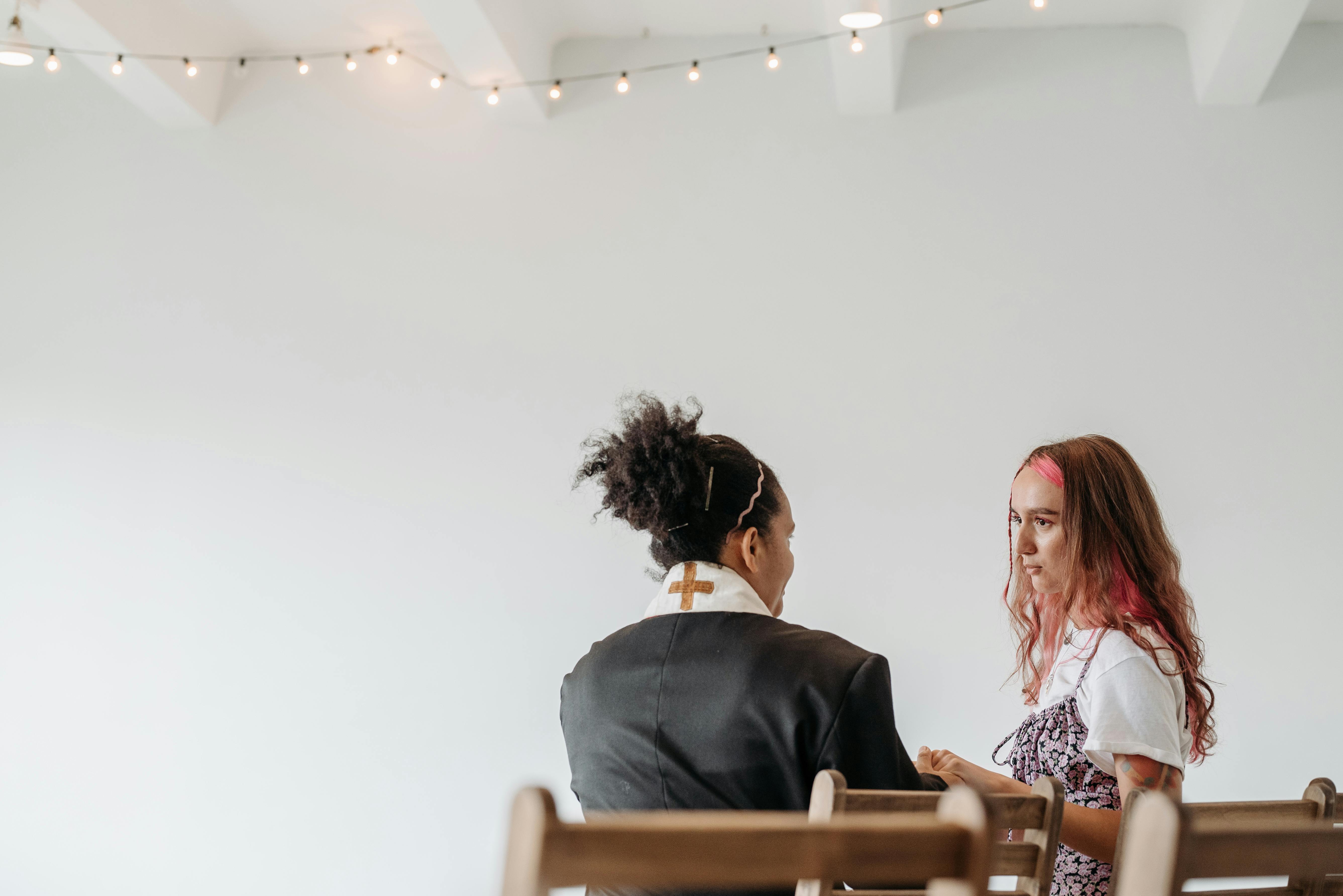 two pastors discussing together in church meeting