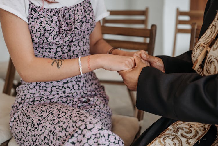 Pastor Praying Together With A Parishioner