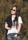 Woman in White Shirt and Black Blazer Wearing Sunglasses